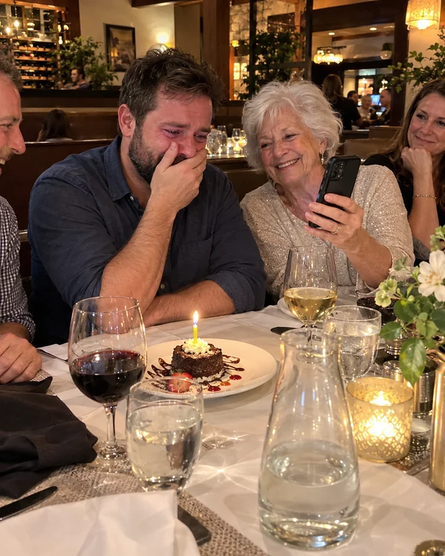 A bearded man of about forty with his hand over his mouth, listening to a phone his white-haired mother holds up at a restaurant table (AI photo, fictional people)
