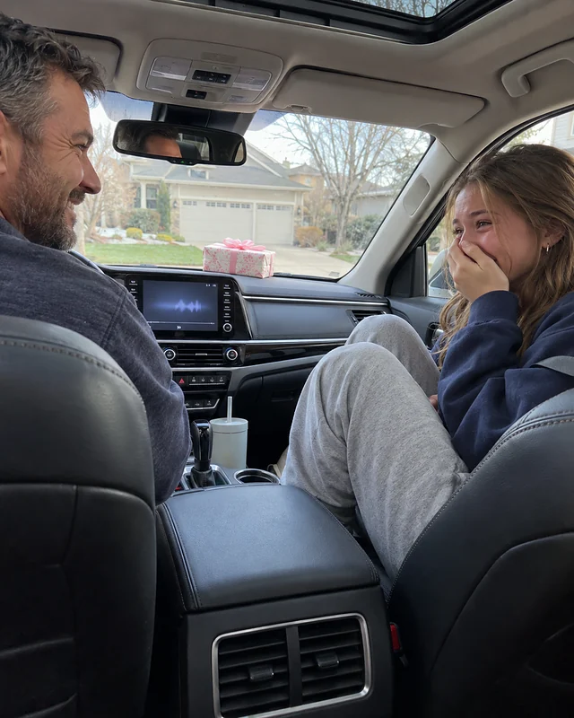 A sixteen-year-old girl in a car's passenger seat covers her mouth, laughing and teary, while her father at the wheel glances over smiling (AI photo, fictional people)